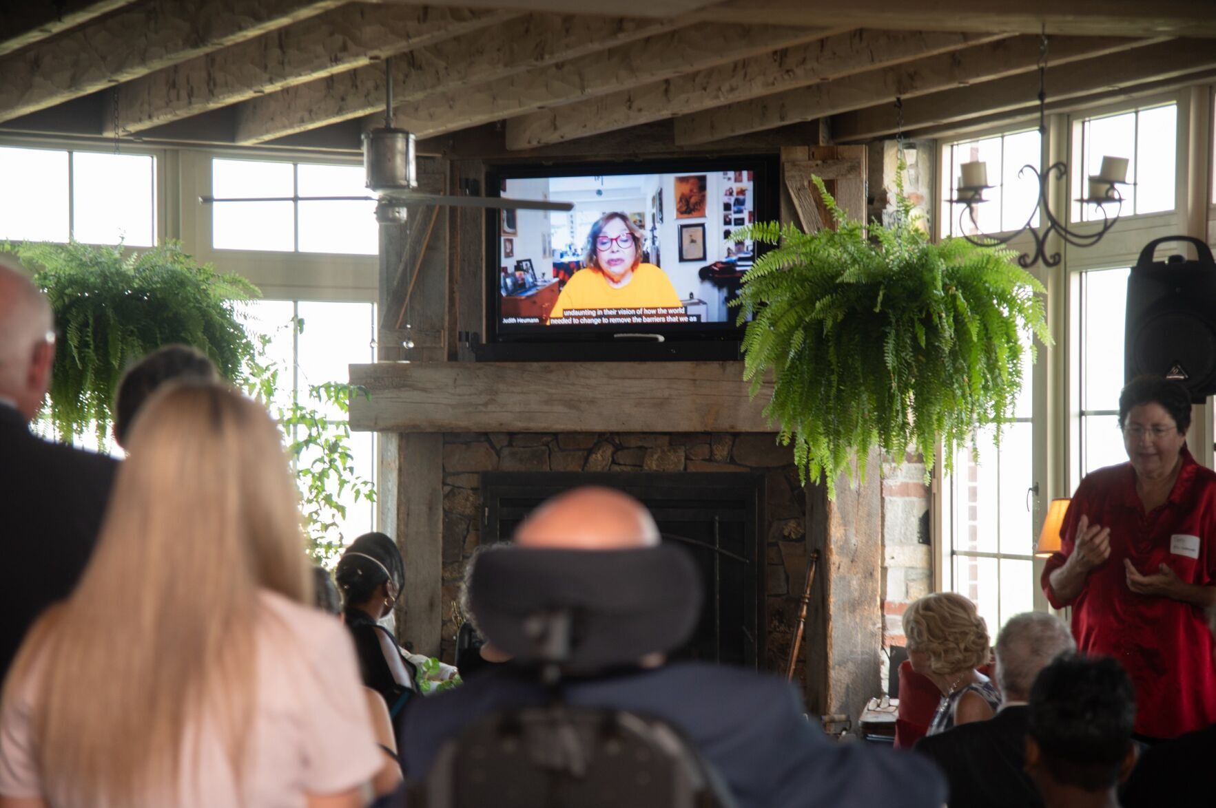 Guests watch a video during Vistas and Visionaries